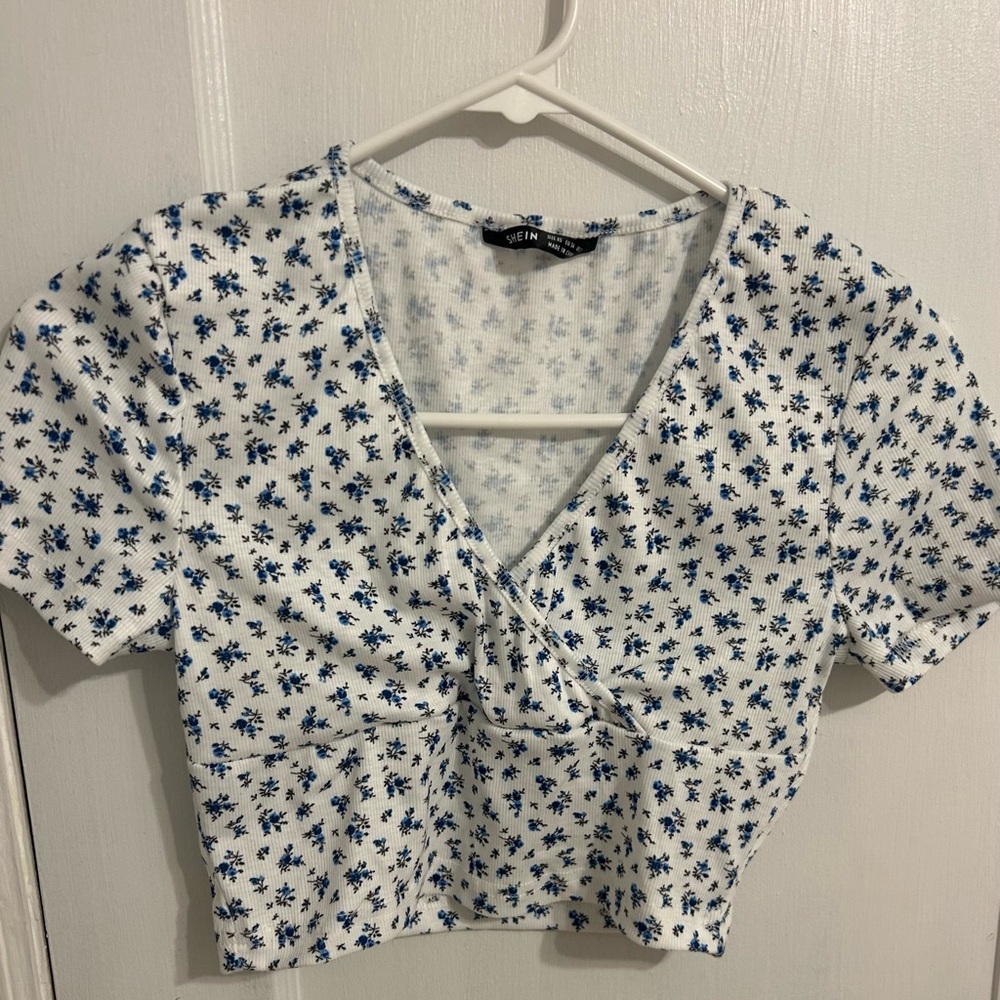 Blue floral wrap top